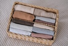 baby clothes in a wicker container vertical cloth 2023 11 27 05 36 26 utc min 1 1